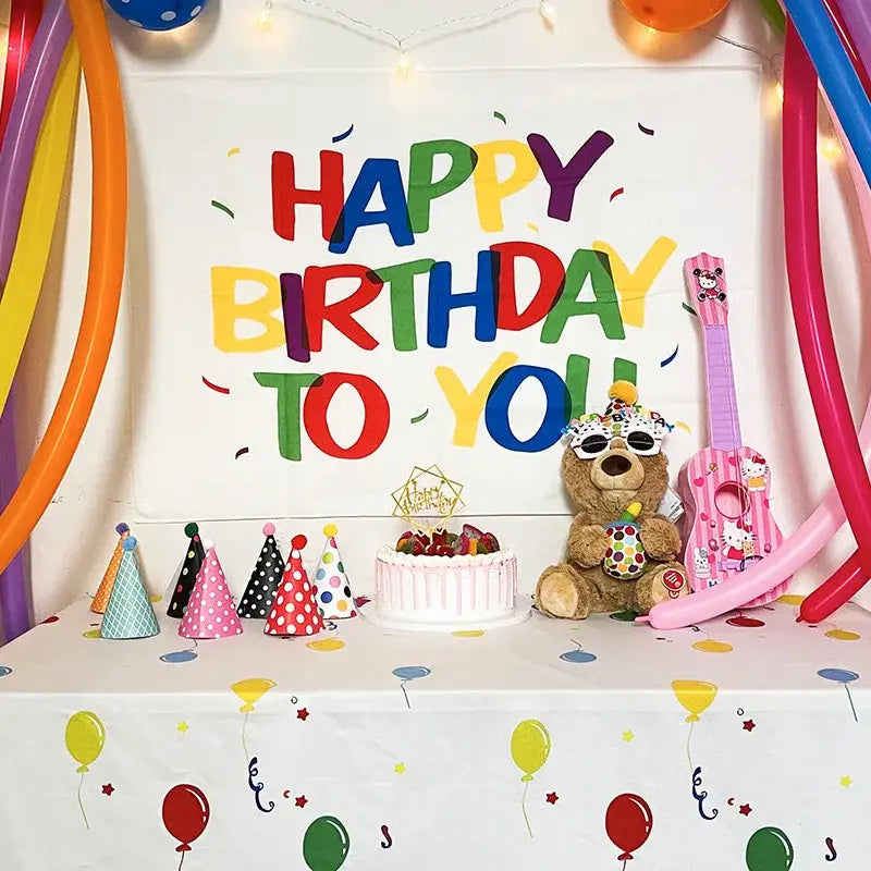 A colorful cartoon animal birthday wall tapestry featuring a plush brown teddy bear and pink hello kitty ukulele decorbites birthday wall decor
