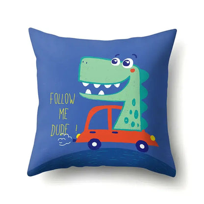 Colorful dino baby pillowcase by decorbites features a blue throw pillow with a green dinosaur in an orange car decorbites dino baby