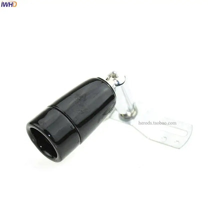 Black cylindrical magnetic connector with metallic clasp and bracket on decorbites ceramic e14 socket bulb holder back side