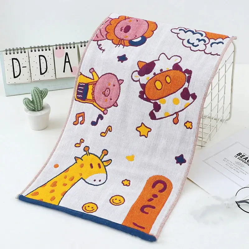 White cotton hand towels with colorful cartoon dinosaur and cat prints and blue border from decorbites cat gauze set