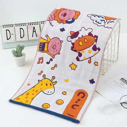 White cotton hand towels with colorful cartoon dinosaur and cat prints and blue border from decorbites cat gauze set