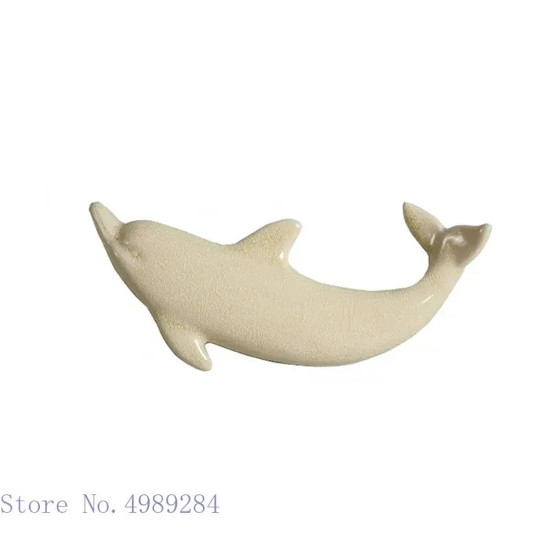 Cream-colored ceramic dolphin fish ocean figurine with smooth glossy finish for colorful wall decoration decorbites dolphin fish