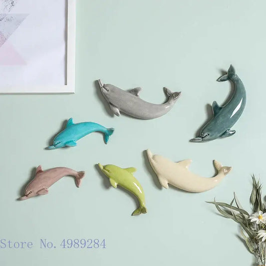 Six colorful ceramic dolphin fish ocean wall decoration in gray teal pink lime green and cream for children’s room decorbites dolphin fish