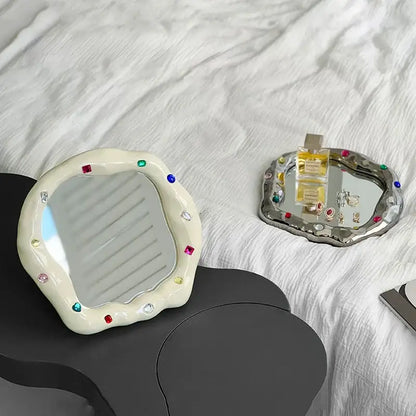 Cream ceramic makeup mirror with irregular edge and colorful gemstones for bedroom vanity use