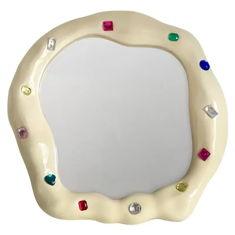 Cream ceramic makeup mirror with irregular edge decorated with colorful square and round gemstones for bedroom use
