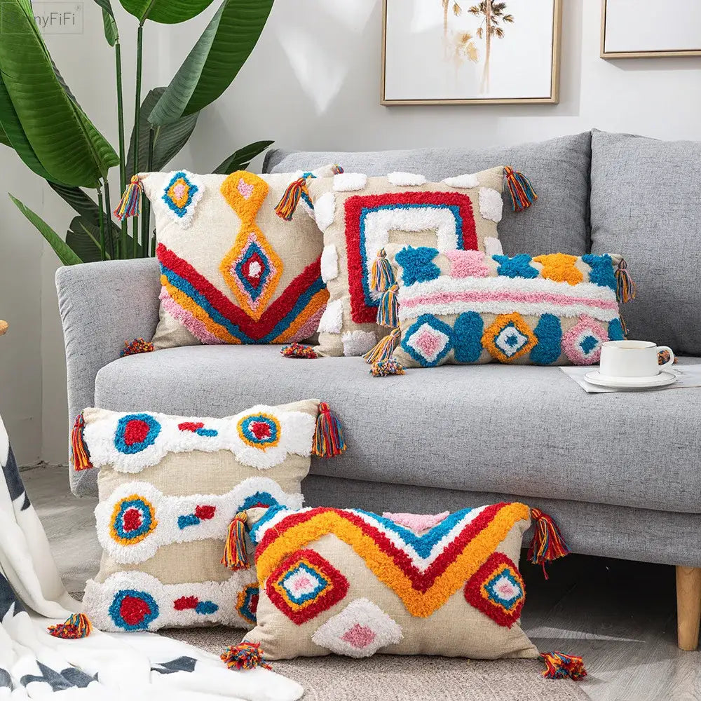 Colorful geometric boho tassel macrame pillow covers with vibrant textured patterns in red blue yellow orange pink and white decorbites boho tassel