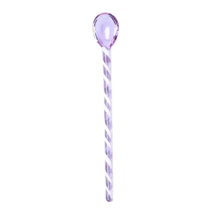 A translucent lavender glass hairpin with a twisted spiral design from decorbites colorful glass stirring spoon set
