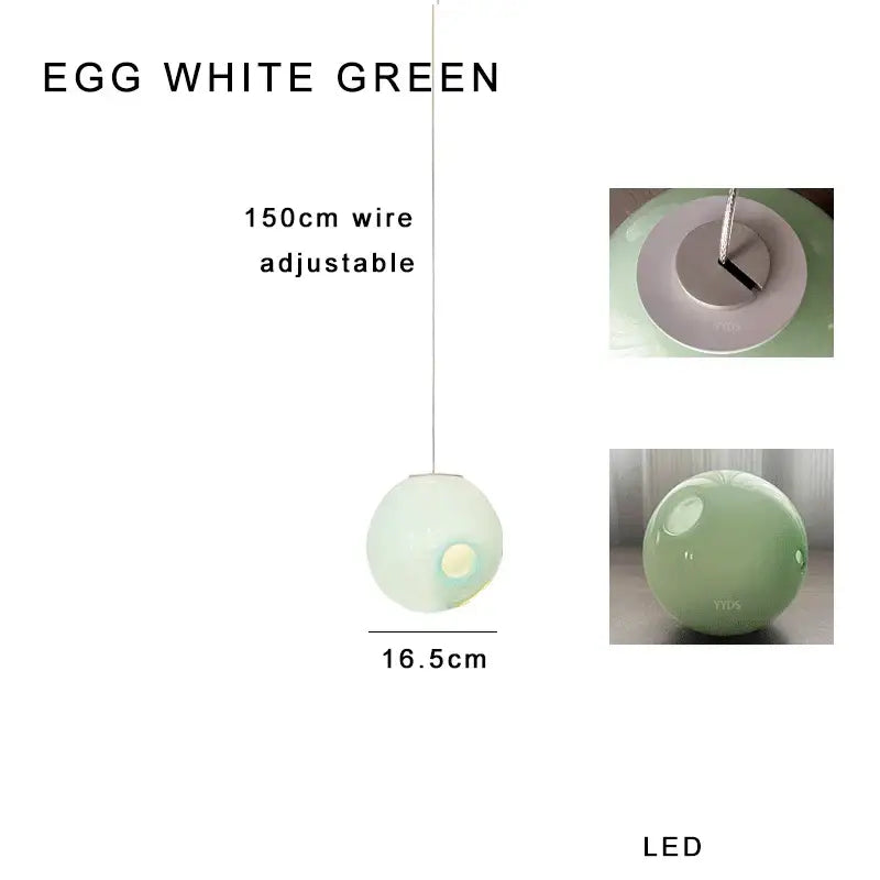 A soft translucent eggshell green spherical pendant light with colorful glaze glass and adjustable wire suspension