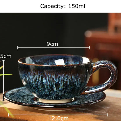 A deep blue colorful glazed porcelain tea cup and matching saucer set with a speckled glossy finish for dining room decor