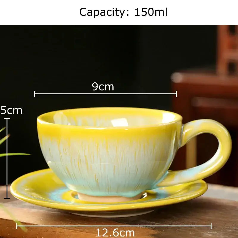 A colorful glazed porcelain tea cup and saucer set with vibrant yellow and light blue gradient and glossy finish