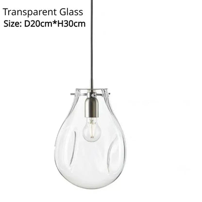 Clear glass teardrop pendant light with subtle ridges and sleek metallic fixture for colorful modern glass chandelier decorbites