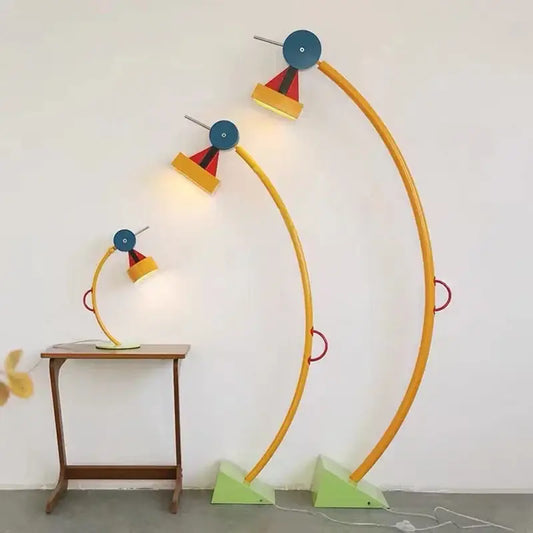 Set of three colorful decorbites kids treetop led floor lamps with yellow arms blue heads red accents and green bases