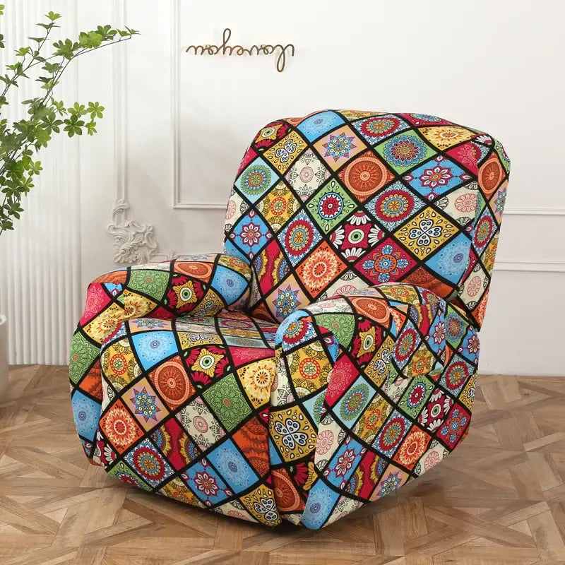A vibrant colorful patchwork elastic sofa cover with mandala patterns in reds, blues, greens, and yellows for recliners