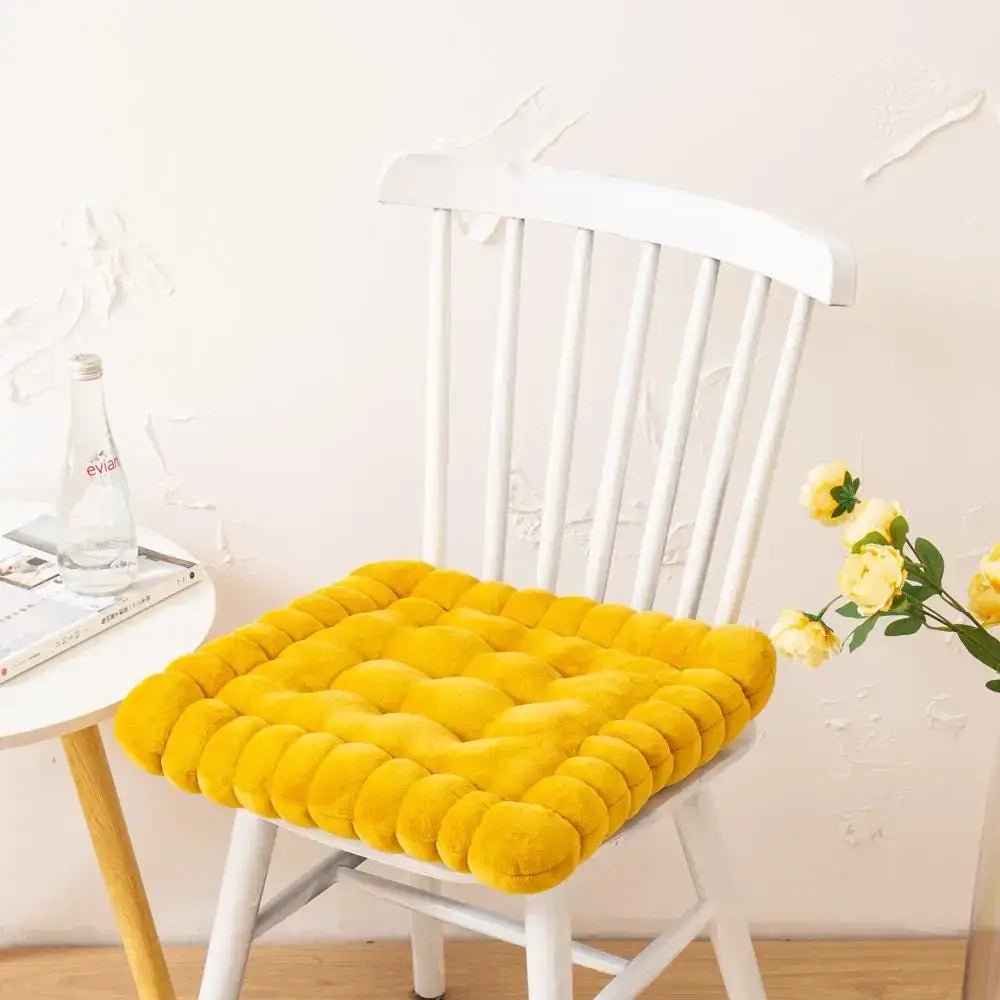 Bright yellow plush quilted cookie biscuit cushion with soft velvety texture for living room square pillow