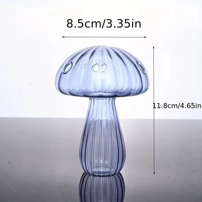 A translucent blue glass mushroom-shaped vase with vertical ridges and three circular indentations for home decor