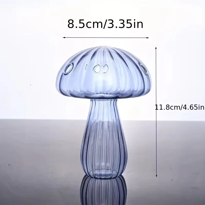 A translucent blue glass mushroom-shaped vase with vertical ridges and three circular indentations for home decor