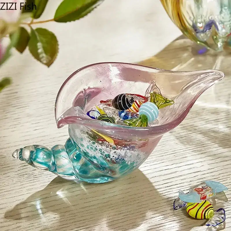 Decorbites conch candy jar with translucent pink and teal glass seashell ornament filled with colorful beads on green tray