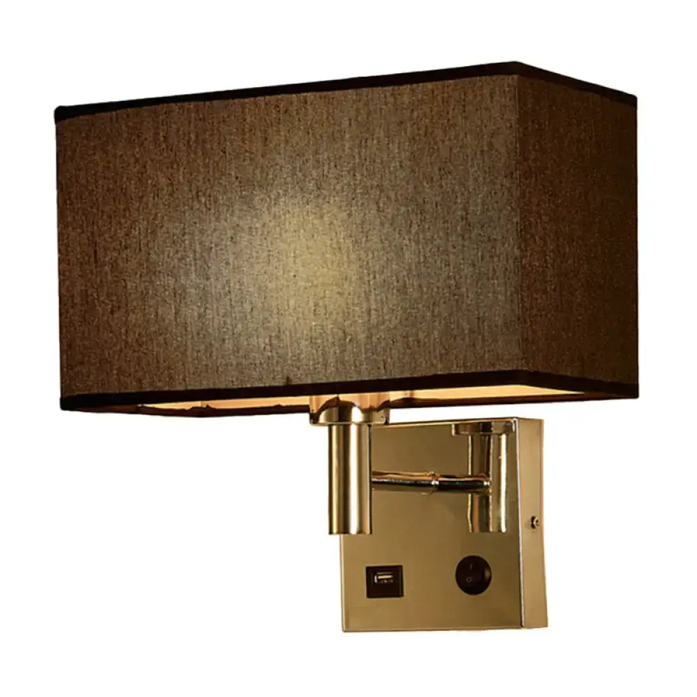 Contemporary wall lamp with brass finish beige fabric shade and integrated usb port for bedroom lighting