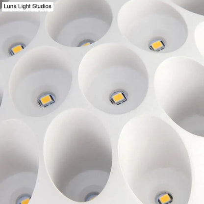 Contemporary black and gold spherical wall lamp with white led panel featuring square yellowish light emitters for bedroom