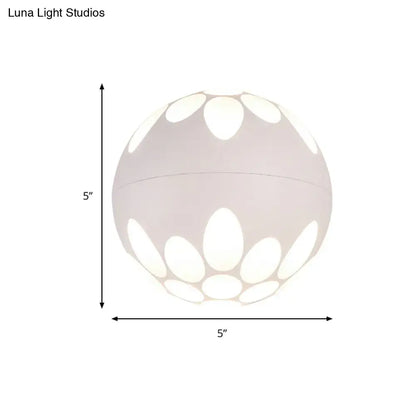 Contemporary white spherical pendant wall light with petal-shaped cutout pattern for bedroom lighting
