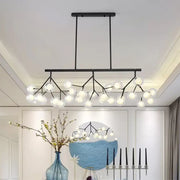 Modern black finish metal chandelier with frosted glass globe bulbs in a bubbles island lighting design