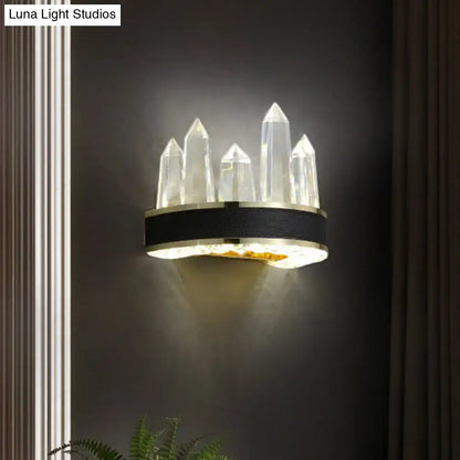 Contemporary black and gold crystal wall mount lighting with clear faceted quartz pillars for living room use