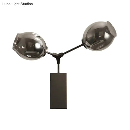 Contemporary black and gold wall sconce with dual-head table lamp design and clear glass shade for bedroom light wall use