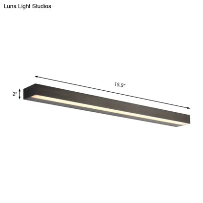 Contemporary black and silver linear vanity sconce with sleek matte black finish and white warm led illumination