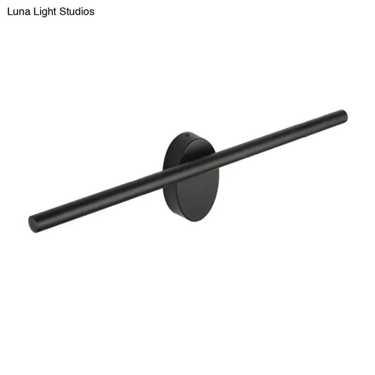Contemporary black matte wall light with slim cylindrical bar and circular base designed for natural light in bedrooms
