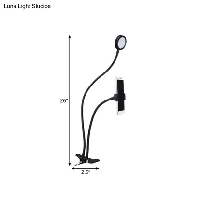 Contemporary black flexible led desk lamp with adjustable clamp and phone holder for bedroom use