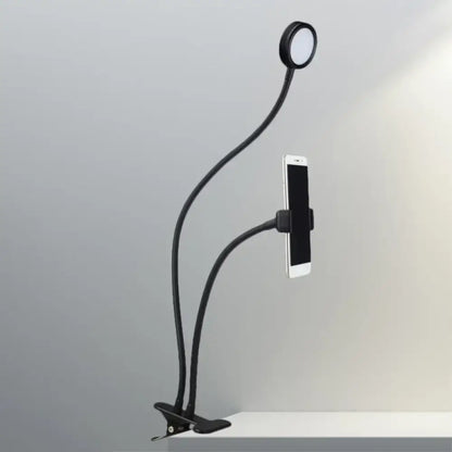 Contemporary black flexible led desk lamp with phone clamp and circular led light head for bedroom use
