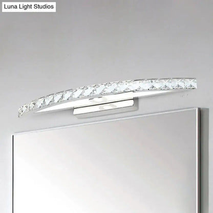 Contemporary bow shaped vanity lighting wall sconce with clear crystal accents and polished chrome finish for bathroom