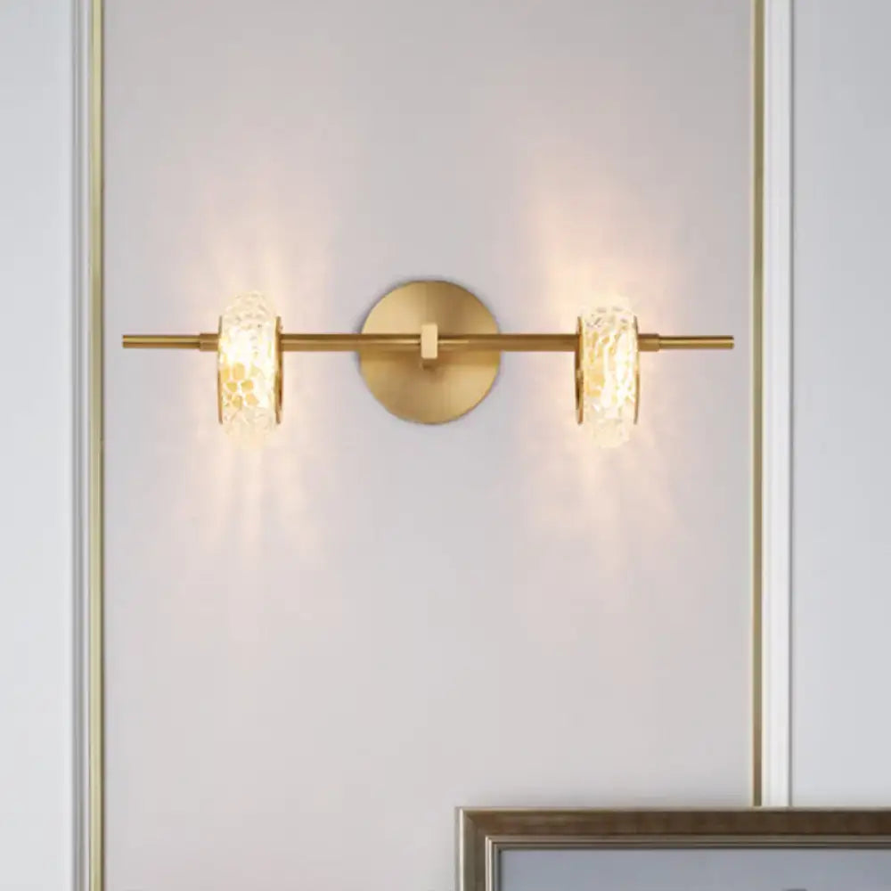 Contemporary brass double oval light fixture with textured glass shades and circular mounting plate for 220v-240v use
