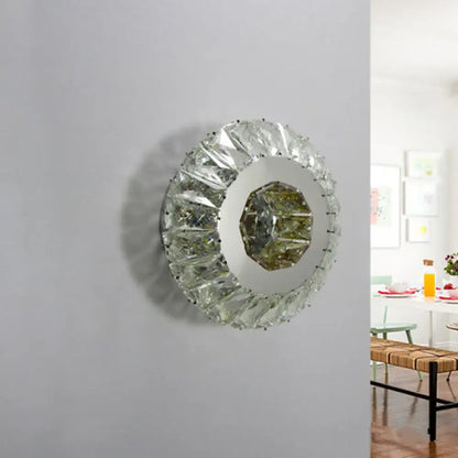 Contemporary chrome crystal wall lamp featuring a round faceted mirror with octagonal central glass panel