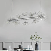Modern chrome pendant ceiling light with clear crystals and dandelion clusters, ideal for dining rooms by DecorBites™