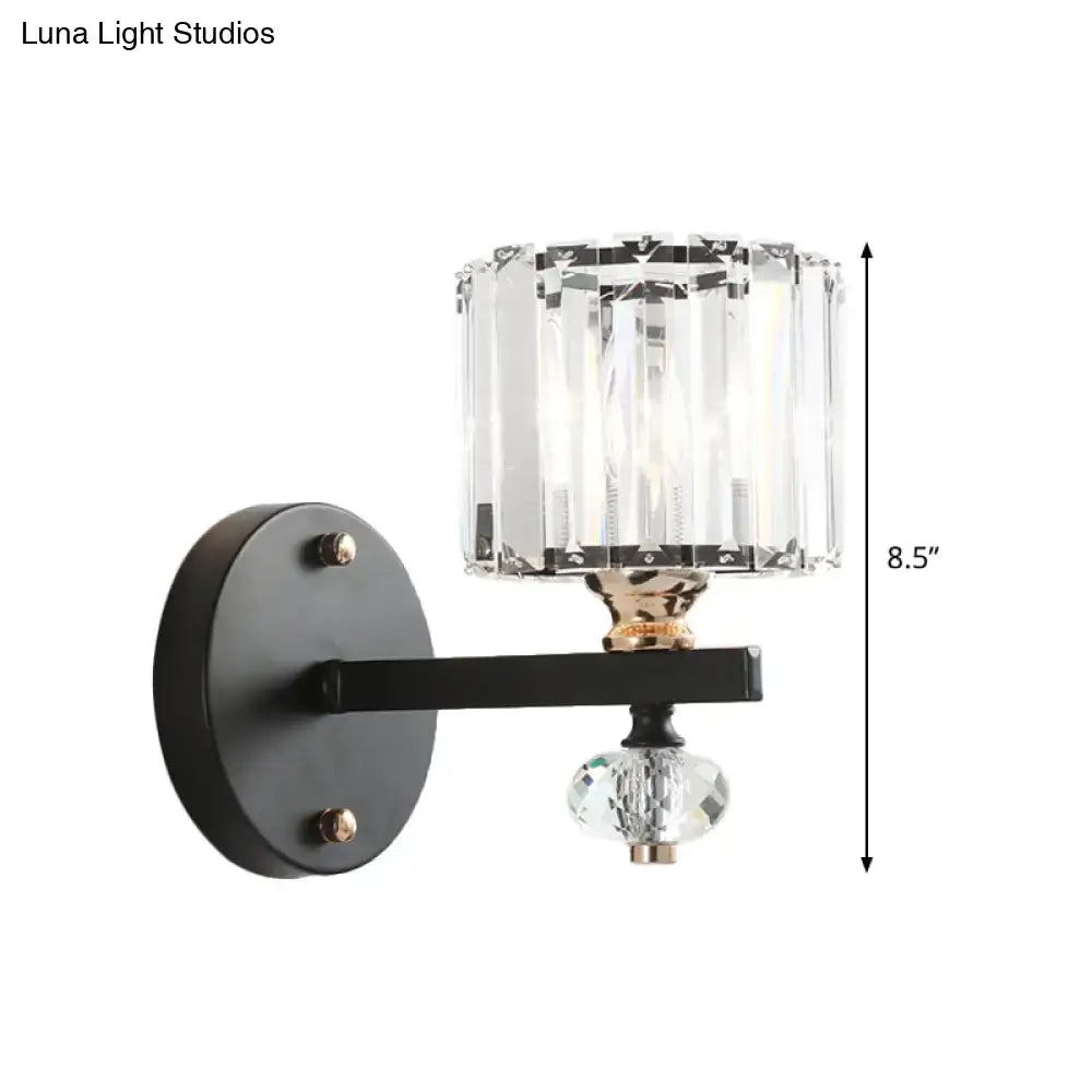 Black metal drum sconce light with contemporary clear ribbed glass cylinder shade and faceted crystal orb pendant