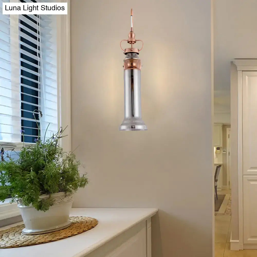 Contemporary copper wall sconce bedroom light with smoke gray amber glass shade and polished chrome body with rose gold accents