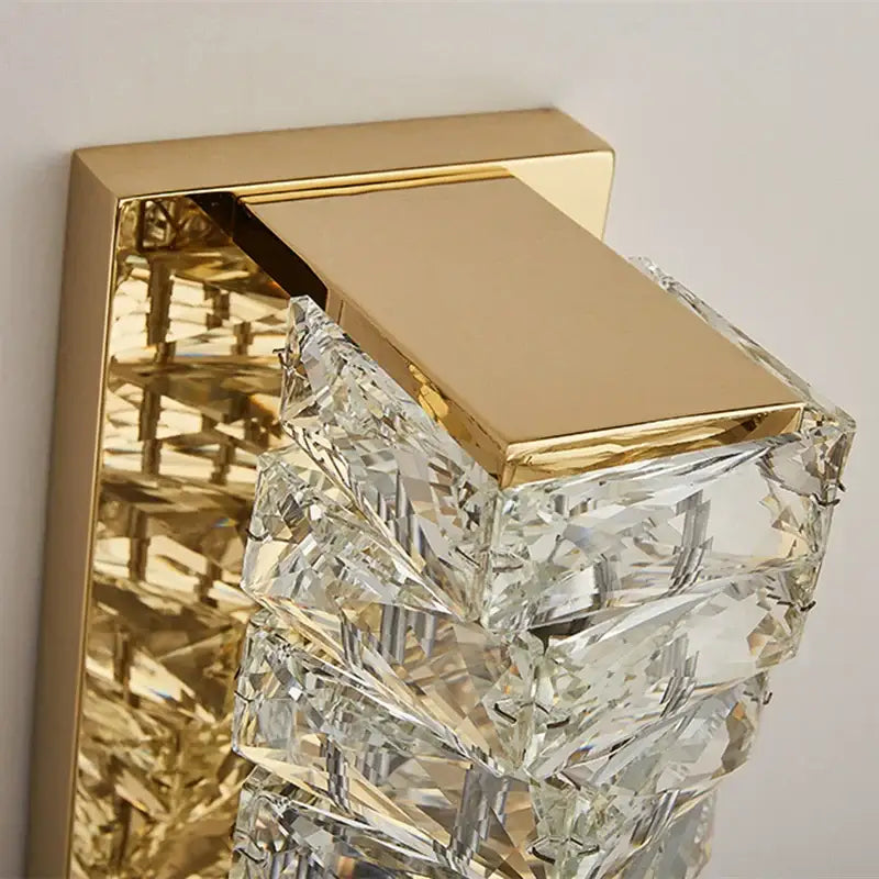 Gold-finished wall sconce with cascading faceted clear crystals by decorbites contemporary crystal for bedroom decor