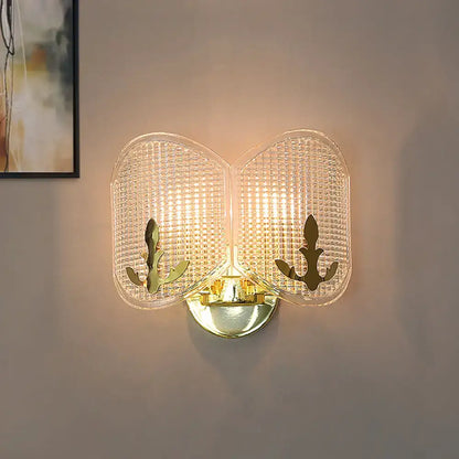 Contemporary gold arc light fixture with two translucent glass panels featuring anchor cutouts for living room use