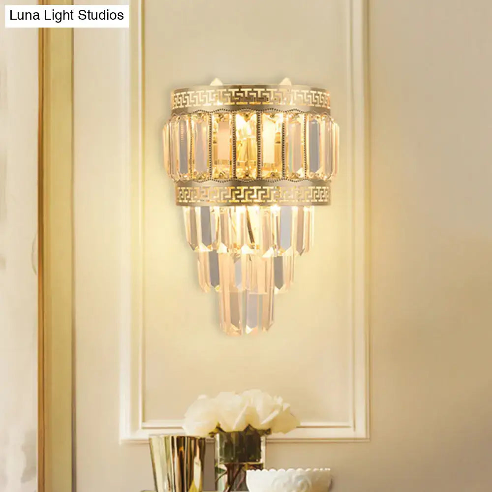 Contemporary gold wall lamp with crystal prisms and greek key pattern detail for bedroom light type fixture