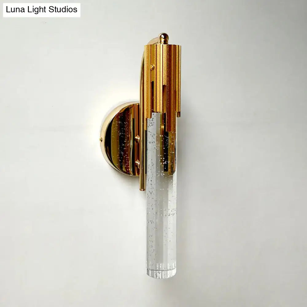 Contemporary gold-toned led light living room sconce with a bubble-textured glass cylinder and bulb included