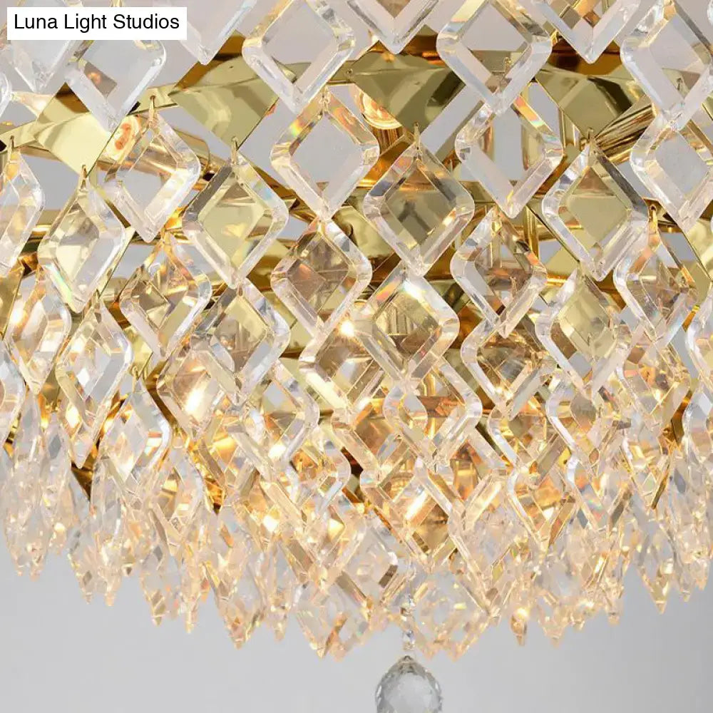 Contemporary gold crystal rhombus chandelier with a golden frame and clear cascading diamond shaped crystals for dining room