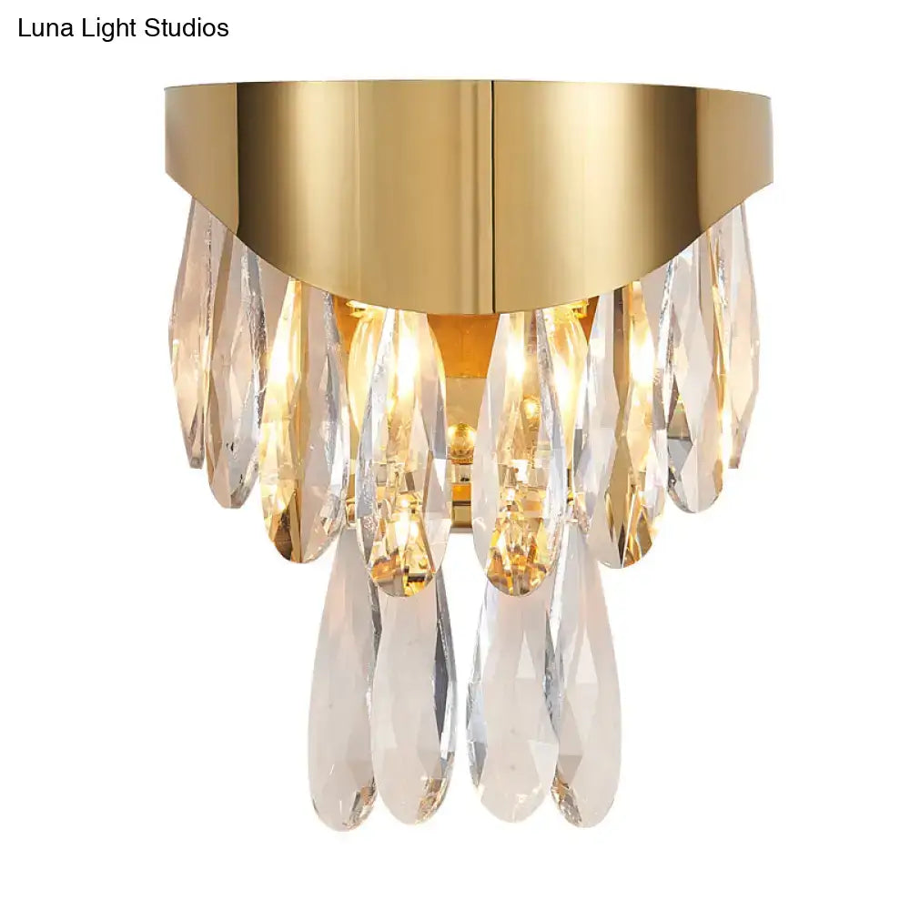 Contemporary gold crystal teardrop wall sconce featuring gold-toned metal and cascading clear crystal pendants for bedroom lighting