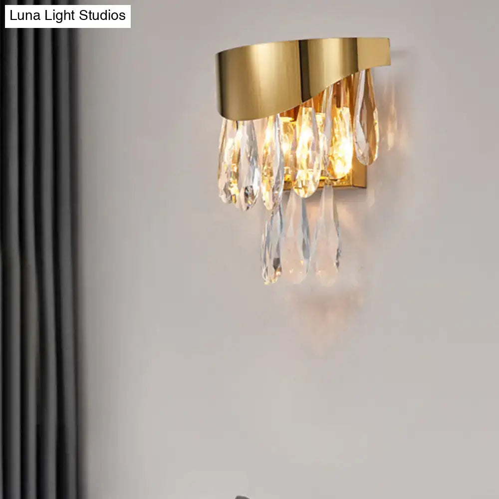 Contemporary gold crystal teardrop wall sconce with cascading crystal teardrops for bedroom lighting
