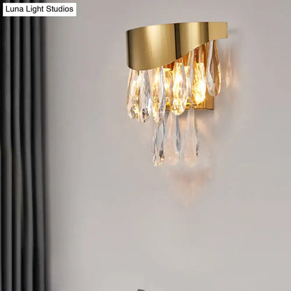 Contemporary gold crystal teardrop wall sconce with cascading crystal teardrops for bedroom lighting