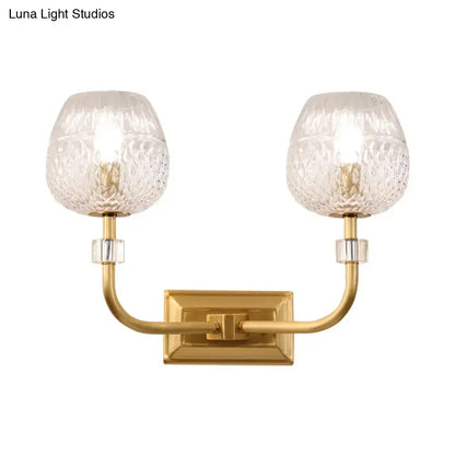 Contemporary gold dome foyer wall light with clear lattice glass and two textured clear glass globe shades