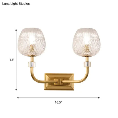 Contemporary gold dome foyer wall light with clear lattice glass globes and gold-toned rectangular mounting plate
