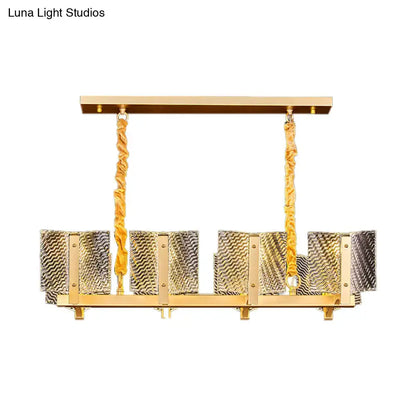 Contemporary gold linear chandelier light fixture with square glass panels and twisted rope-like chains for dining room