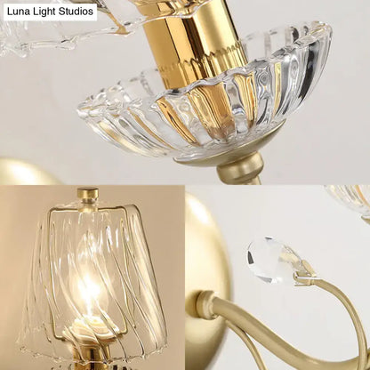 Contemporary gold-finished wall light with swirl glass shades crystal accents and e12 bulb base for bedroom use