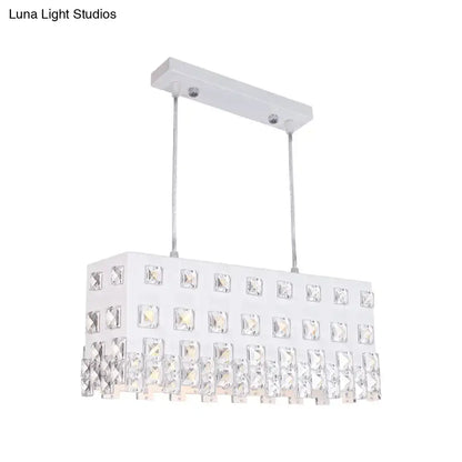 Contemporary ivory metal chandelier with white rectangular pendant and clear crystal accents for dining room